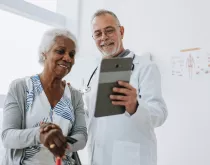 doctor and patient looking at tablet