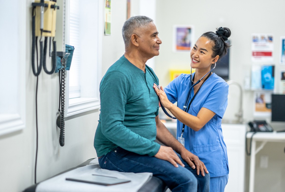 doctor or nurse checking patient blood pressure