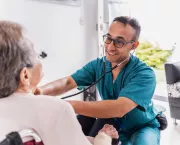 Nurse at home of elderly woman