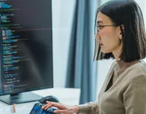 engineer working on software at computer monitor