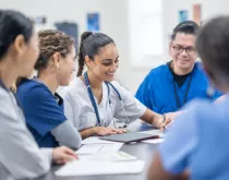 Medical professionals meeting at table