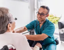 Nurse at home of elderly woman