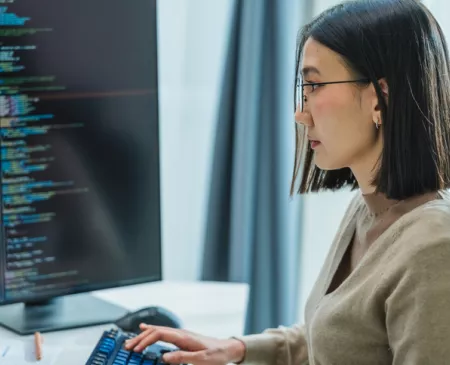 engineer working on software at computer monitor