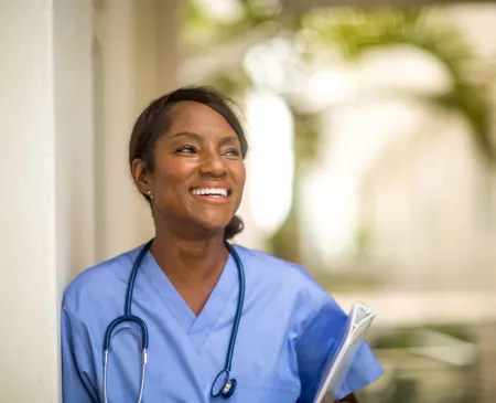 smiling nurse outside