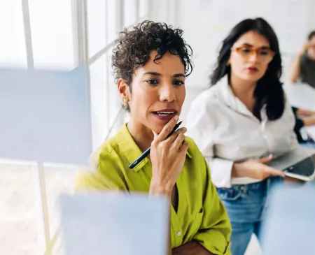 two female coworkers strategizing