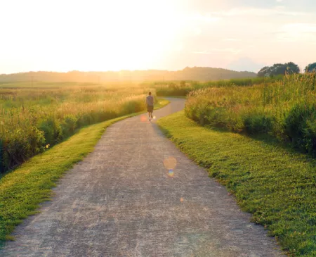 Rural health man running on gravel road