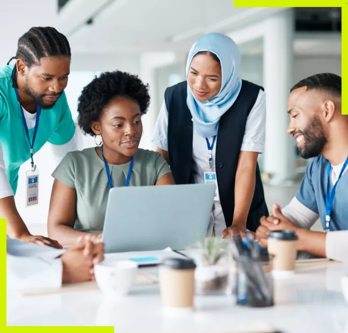 medical coworkers looking at computer