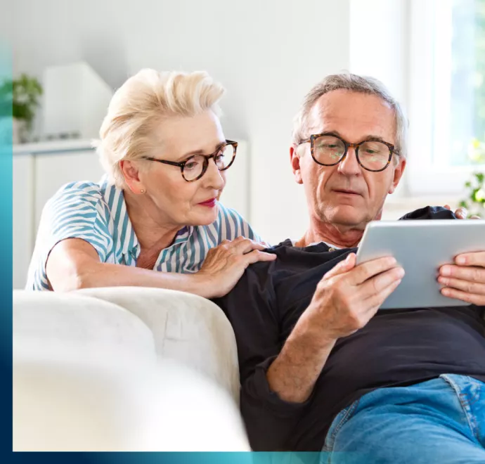 older couple looking at tablet